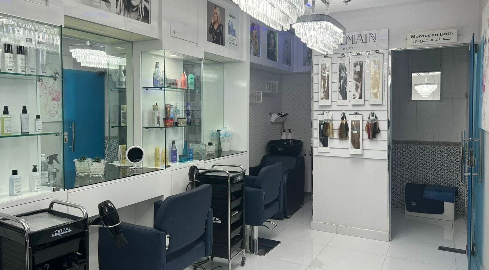 Elegant interior of Sheira Beauty Salon in Dubai, AE, showcasing styling stations and luxury hair care products.