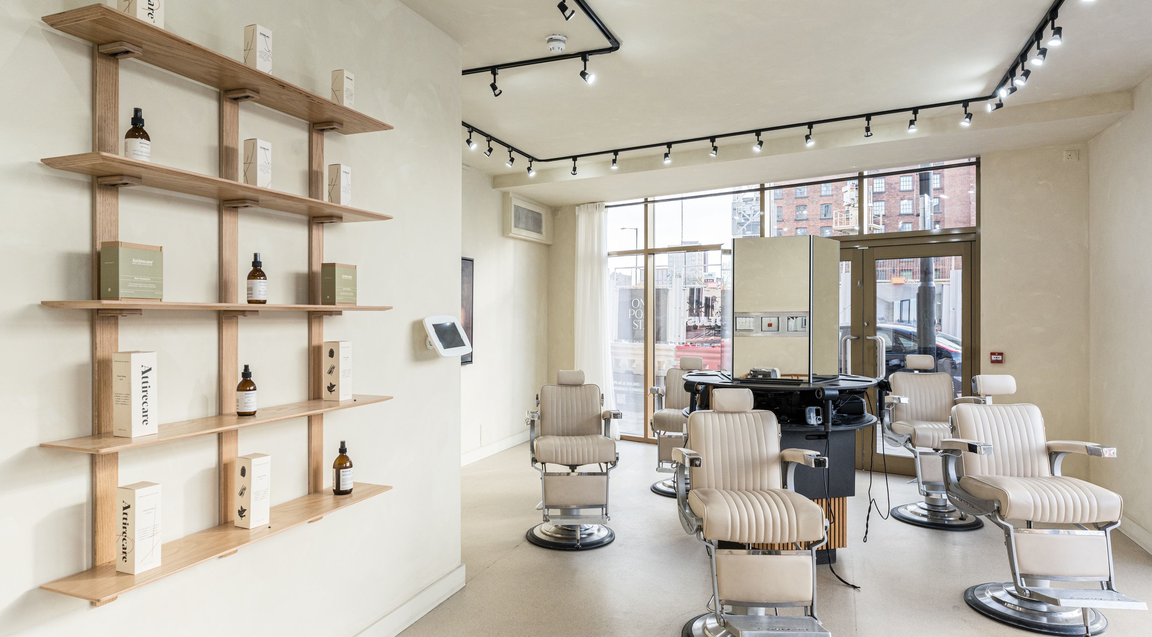 Modern interior of NOTJUST - Ancoats - City Centre, Manchester, with stylish chairs and shelves.