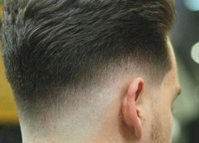 Sleek fade haircut at Snow White Fades and Pigment Studios, Emporia, Kansas, US, showcasing precision styling.