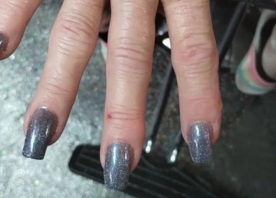 Elegant silver glitter nails at Snow White Fades and Pigment Studios, Emporia, Kansas, US.