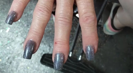 Elegant silver glitter nails at Snow White Fades and Pigment Studios, Emporia, Kansas, US.