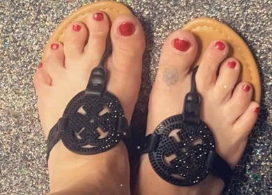Stylish pedicure in black sandals at Snow White Fades and Pigment Studios, Emporia, Kansas, US.