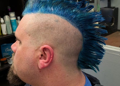Vibrant blue mohawk hairstyle at Snow White Fades and Pigment Studios, Emporia, Kansas, US.