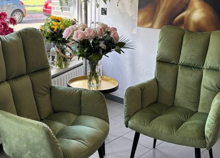Inviting green chairs and flowers in Anima Beauty, Amsterdam, Noord-Holland, NL.
