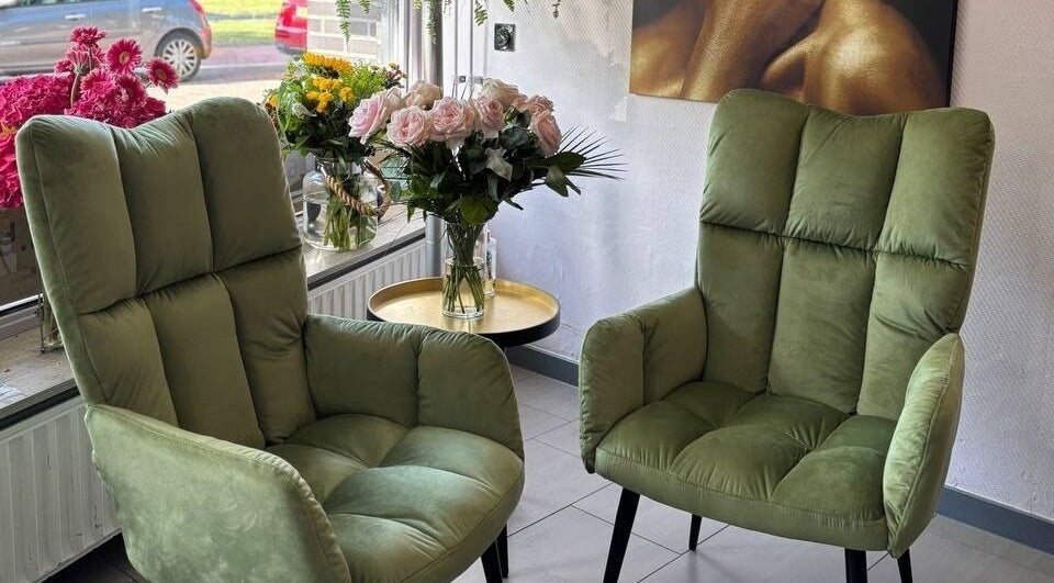 Inviting green chairs and flowers in Anima Beauty, Amsterdam, Noord-Holland, NL.