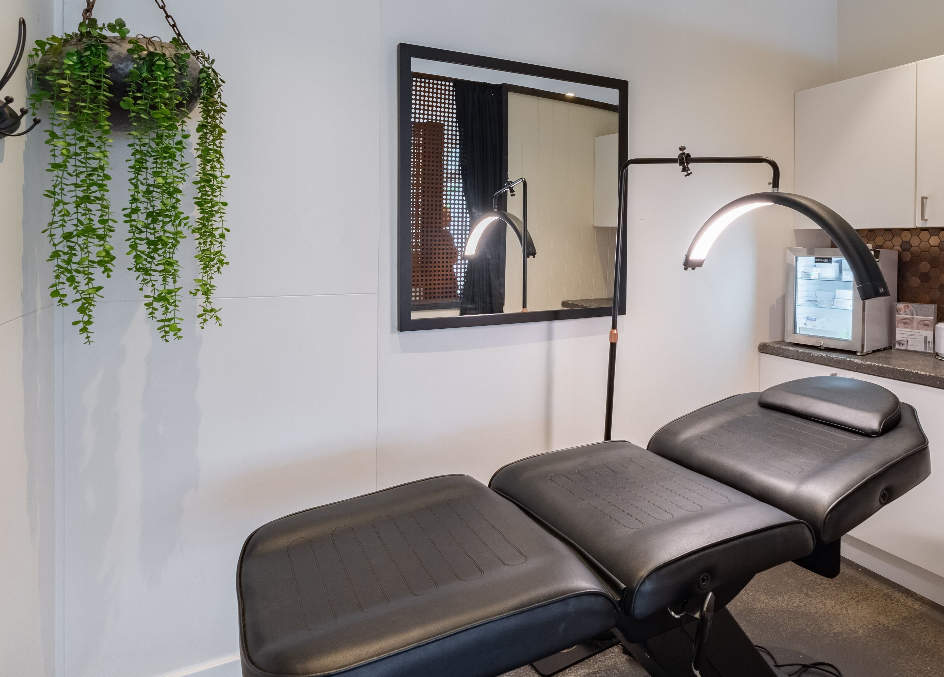 Relaxing treatment room at Honey Tusk Eyebrow Studios - Freshwater, Freshwater, New South Wales, AU with a sleek table.