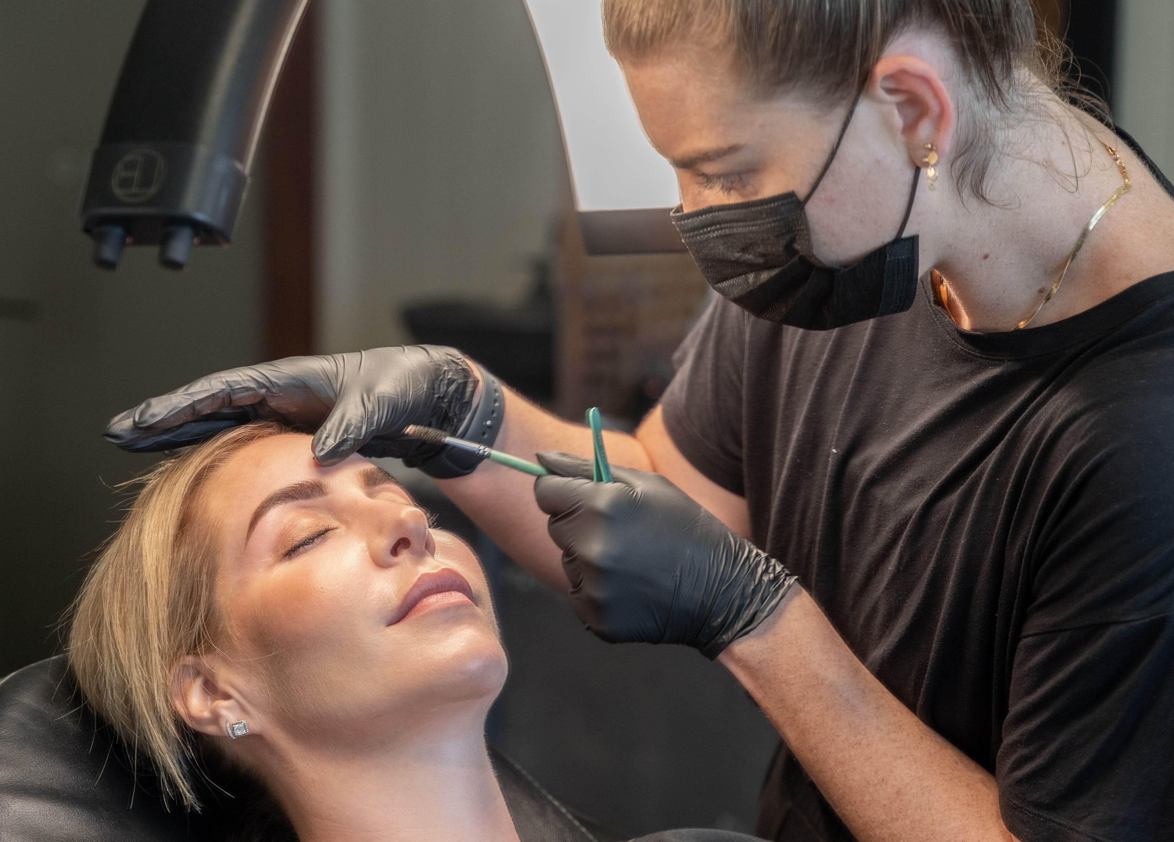 Aesthetician crafting perfect brows at Honey Tusk Eyebrow Studios - Freshwater, Freshwater, New South Wales, AU.