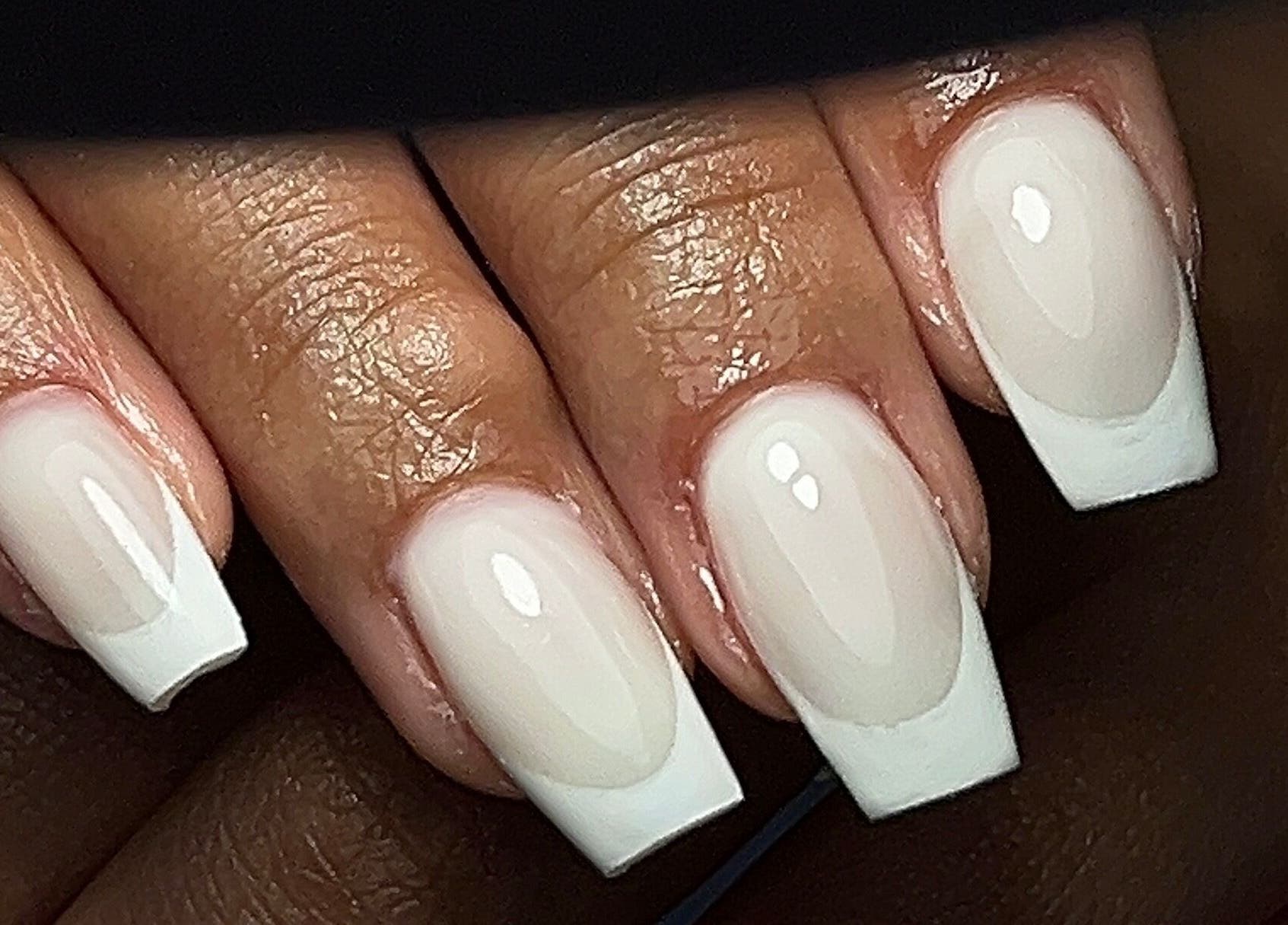 Classic French manicure at The Nail Goddess, Cape Town, Western Cape, ZA, showcasing stylish nail design.