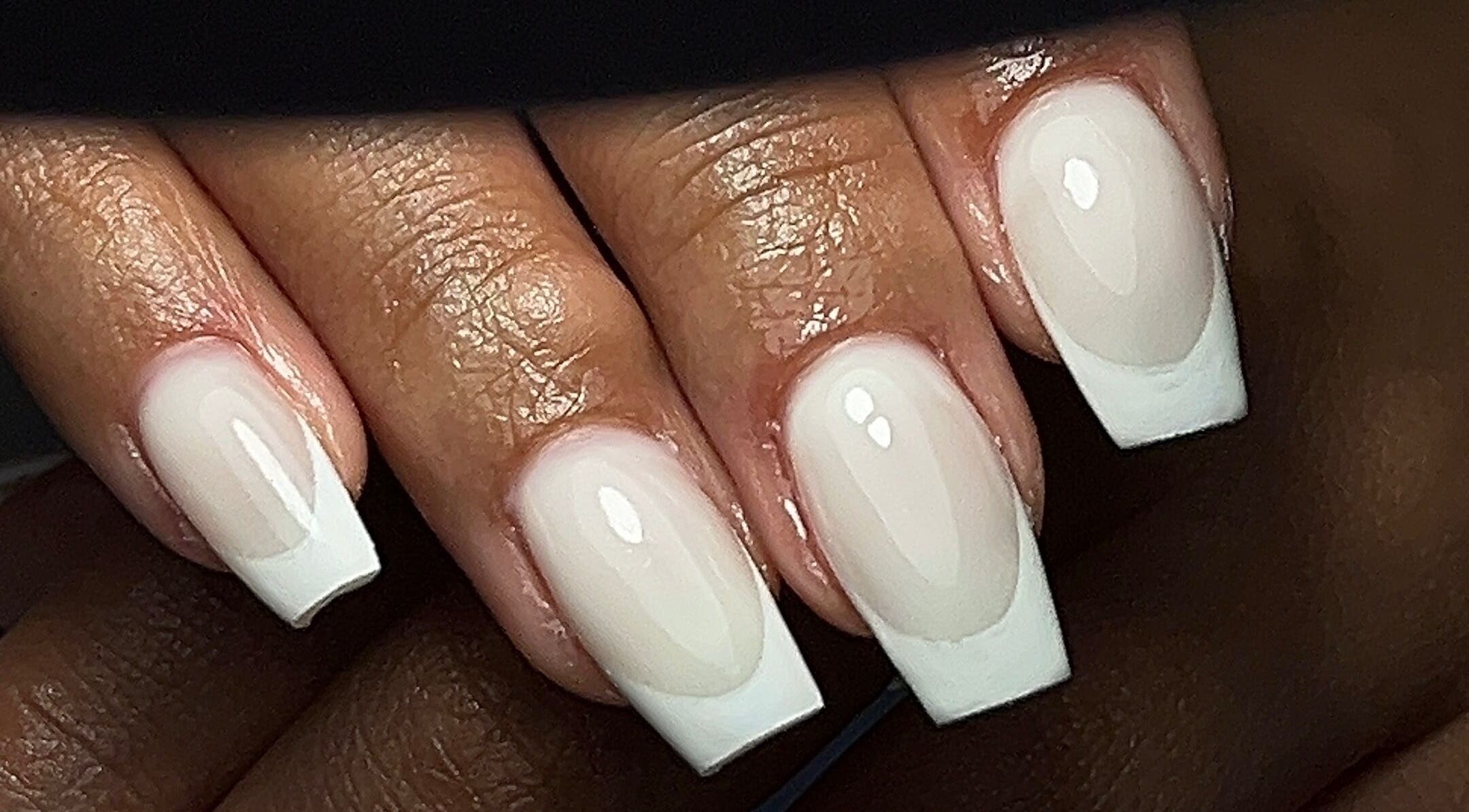 Classic French manicure at The Nail Goddess, Cape Town, Western Cape, ZA, showcasing stylish nail design.
