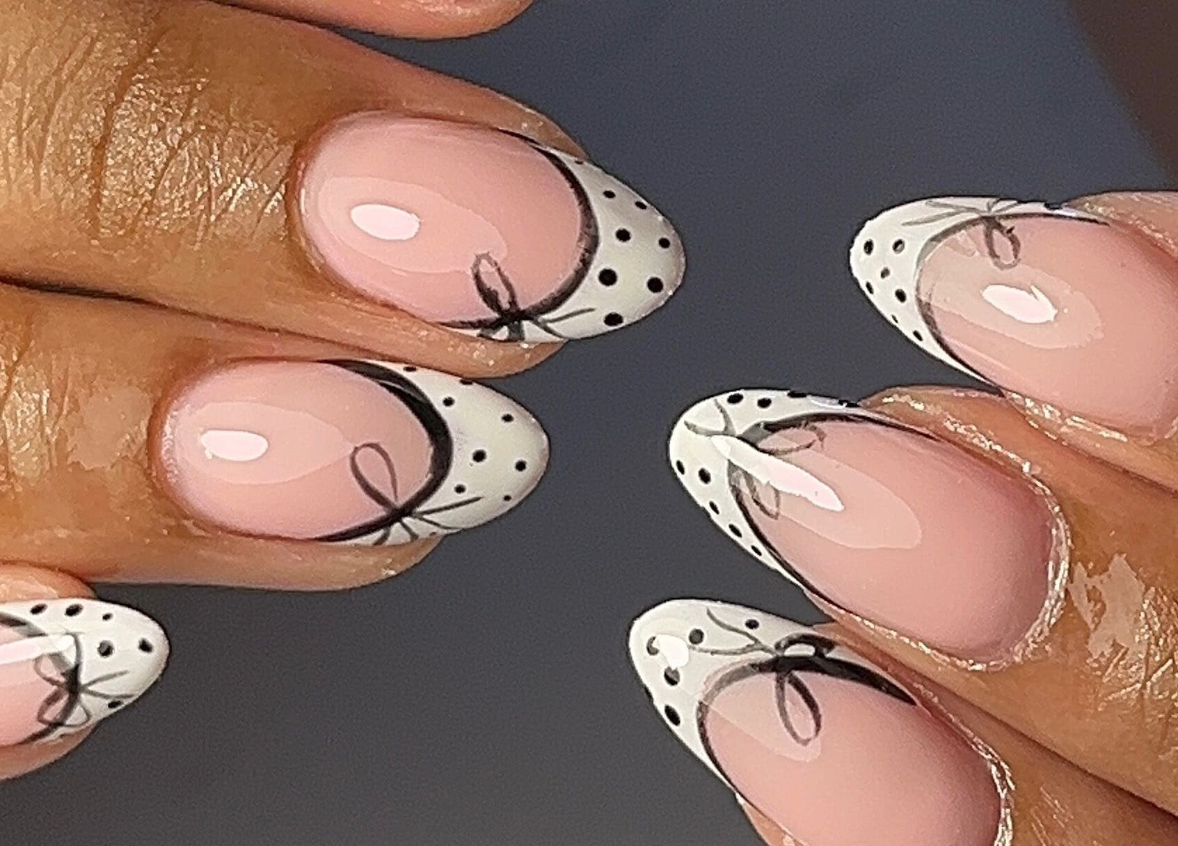 Elegant nail art with dots and bows at The Nail Goddess, Cape Town, Western Cape, ZA.