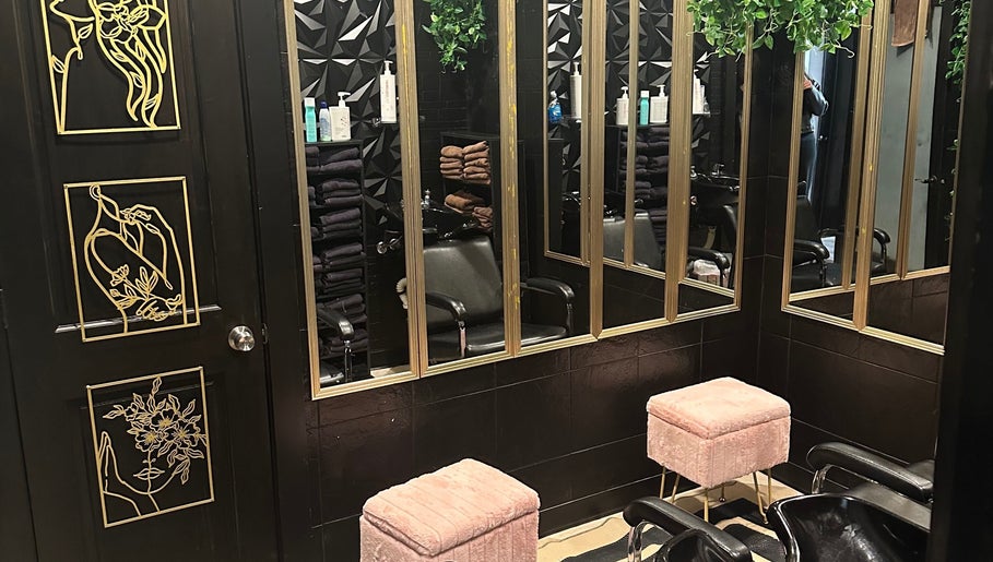 Elegant styling station at Salon Soiree, Denville, New Jersey; mirrors, chairs, and decor creating a modern vibe.