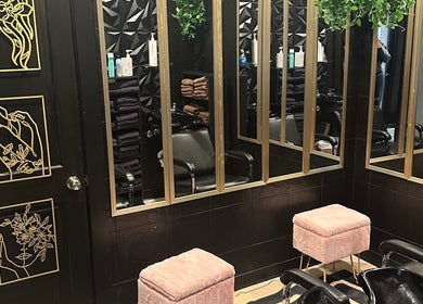 Elegant styling station at Salon Soiree, Denville, New Jersey; mirrors, chairs, and decor creating a modern vibe.