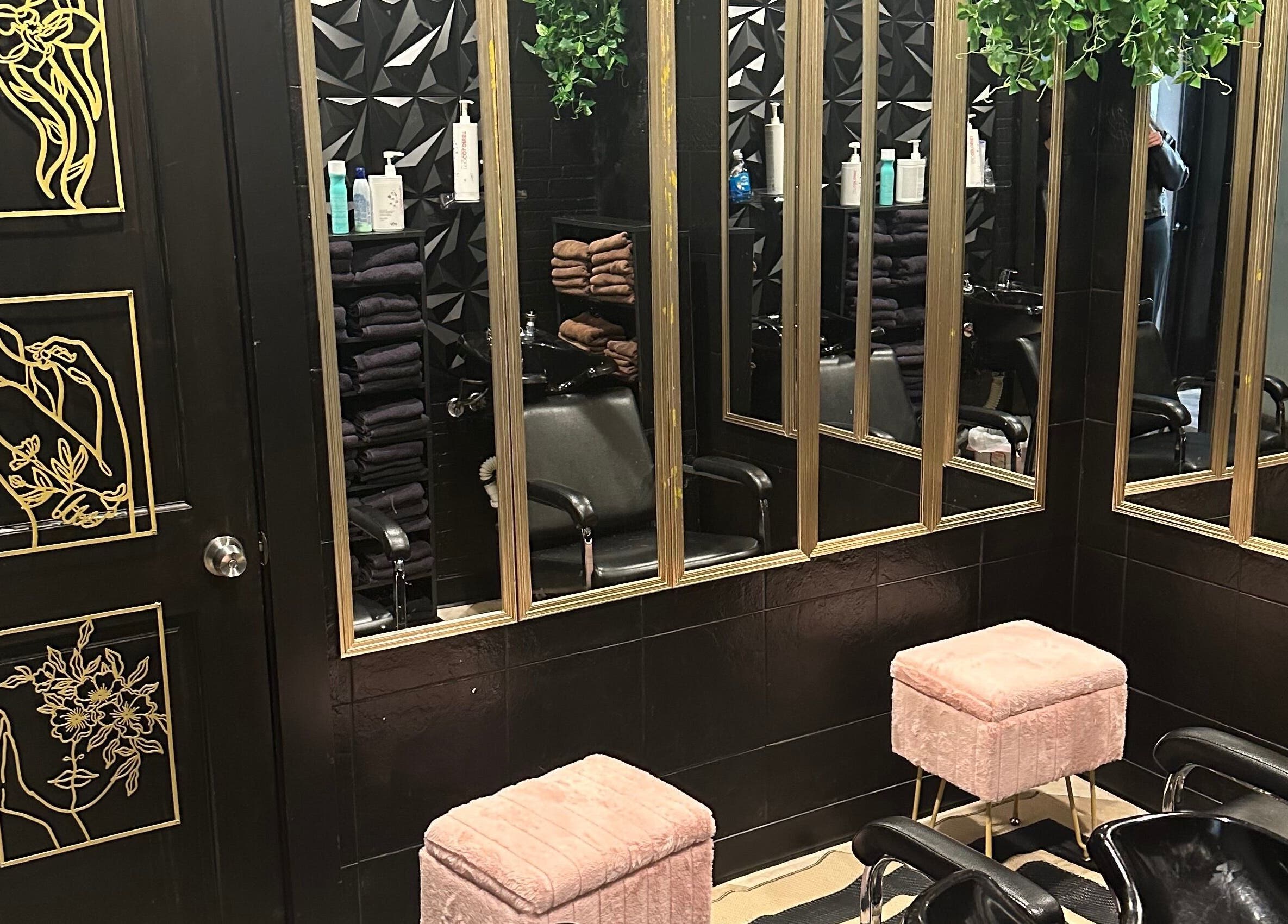 Elegant styling station at Salon Soiree, Denville, New Jersey; mirrors, chairs, and decor creating a modern vibe.