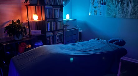 Serene massage room at Black Oasis Luxury Mind and Body, Lithonia, GA, Georgia, US, with calming blue hues.