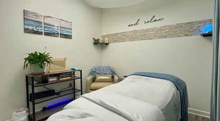 Relaxing spa room at Black Oasis Luxury Mind & Body, Conyers, Georgia, US, with cozy massage bed.