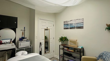 Serene massage room at Black Oasis Luxury Mind & Body in Conyers, Georgia, US, featuring calming decor.