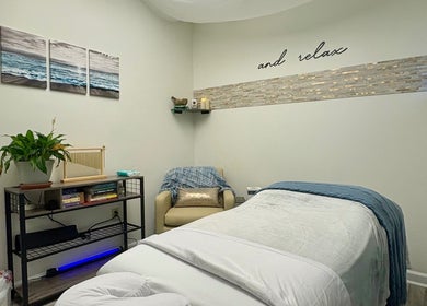 Serene massage room at Black Oasis Luxury Mind & Body, Conyers, Georgia, US with calming decor.