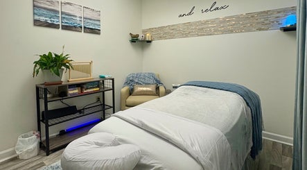 Relaxing massage room at Black Oasis Luxury Mind & Body in Conyers, Georgia, US with calming decor.