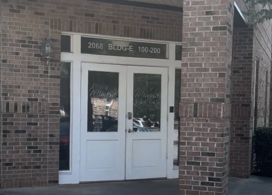 Front entrance of Black Oasis Luxury Mind & Body, Conyers, Georgia, US, with brick exterior.