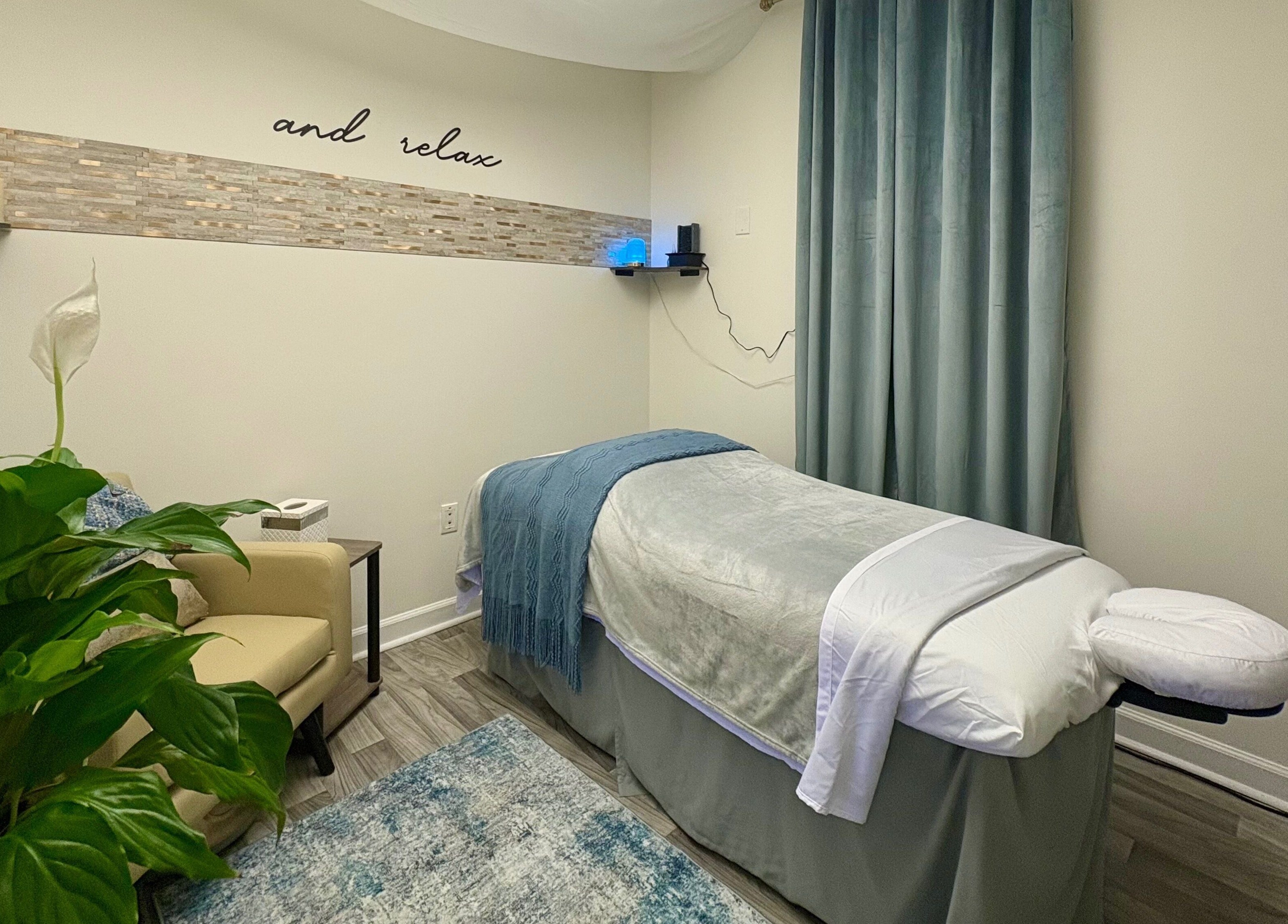 Peaceful treatment room at Black Oasis Luxury Mind & Body, Conyers, Georgia, US, with calming decor and plants.