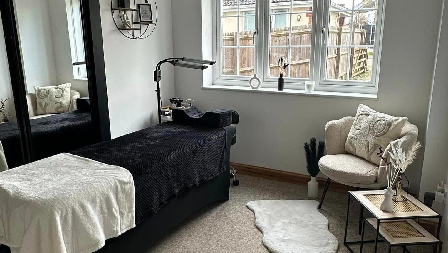 A cozy treatment room at BeautyRush, Andover, England, GB showcasing a plush chair and relaxing decor.