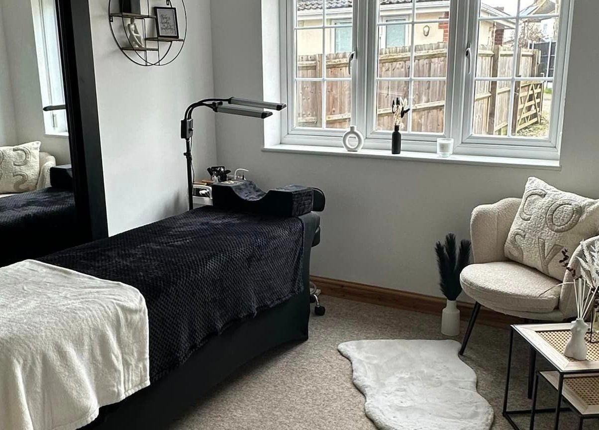 A cozy treatment room at BeautyRush, Andover, England, GB showcasing a plush chair and relaxing decor.