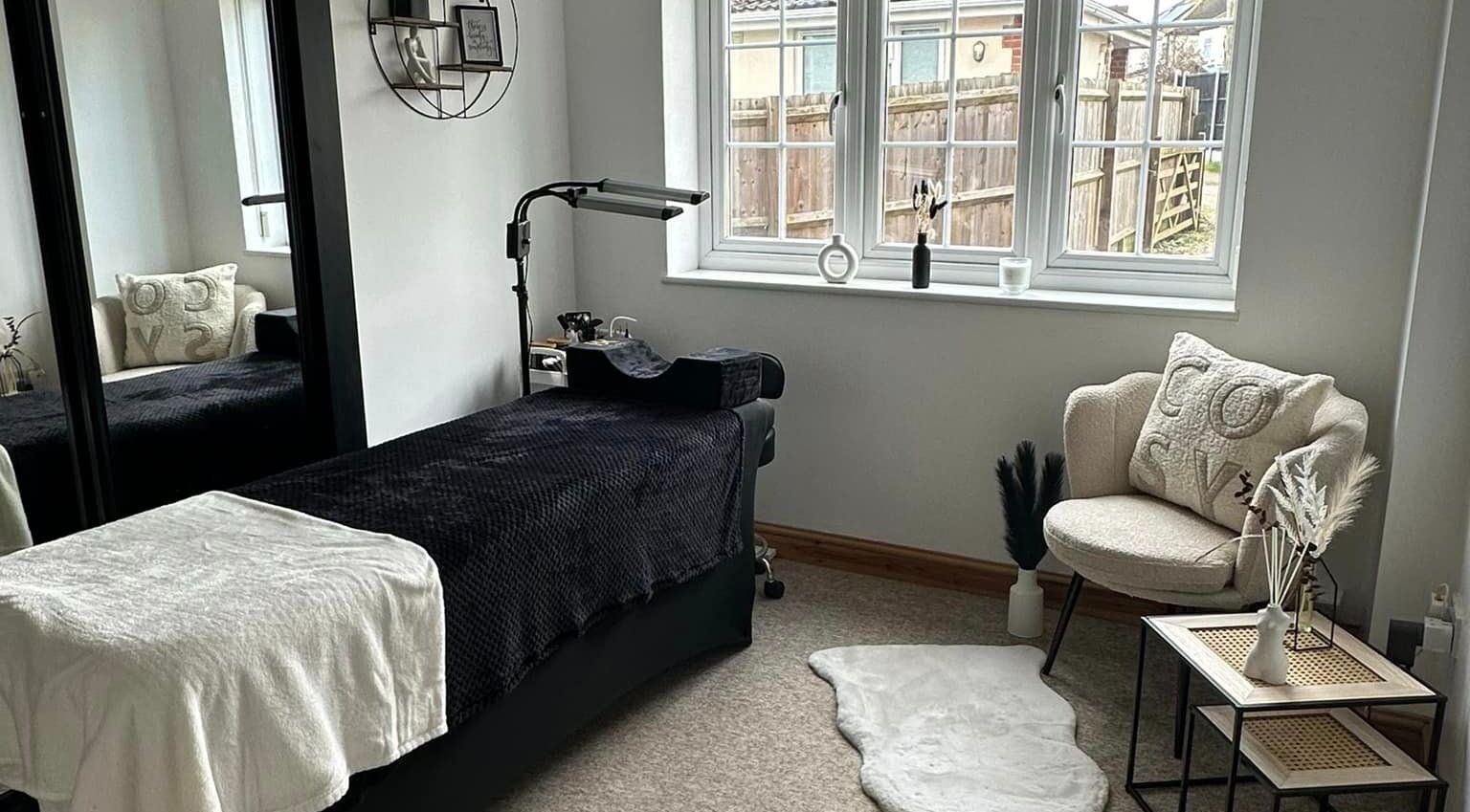 A cozy treatment room at BeautyRush, Andover, England, GB showcasing a plush chair and relaxing decor.