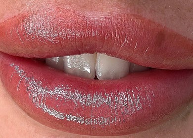 Close-up of glossy lips enhanced by VV Permanent - Benfleet Essex in Benfleet, England, GB.