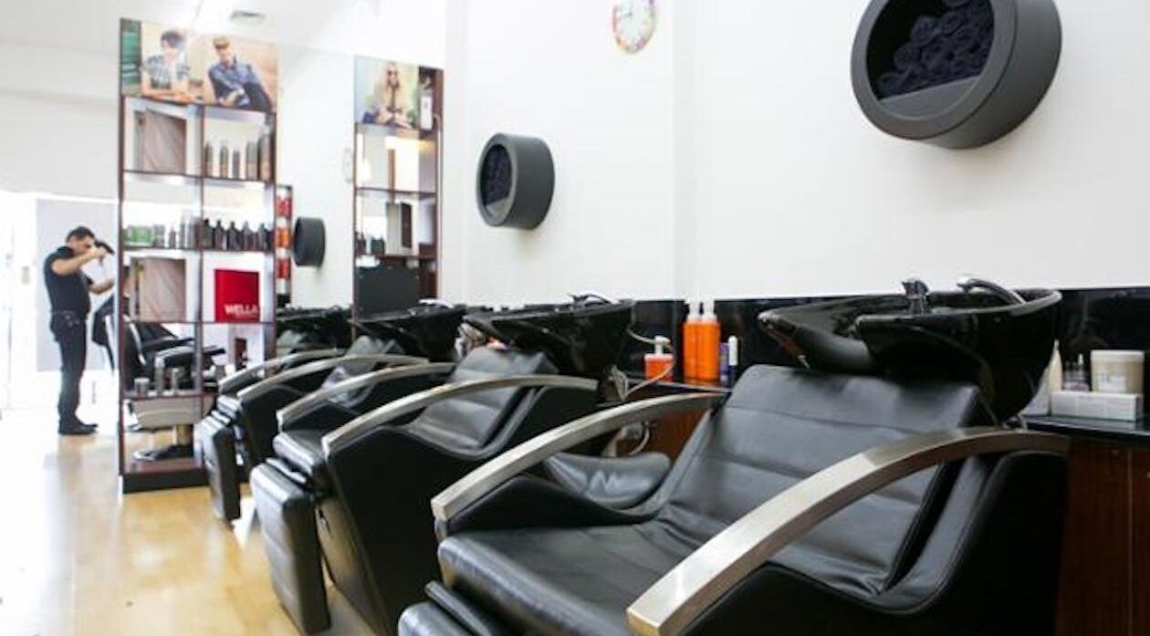 Modern wash stations at Hair Hut Camberwell, Melbourne, Victoria, AU offering a sleek, comfortable salon experience.