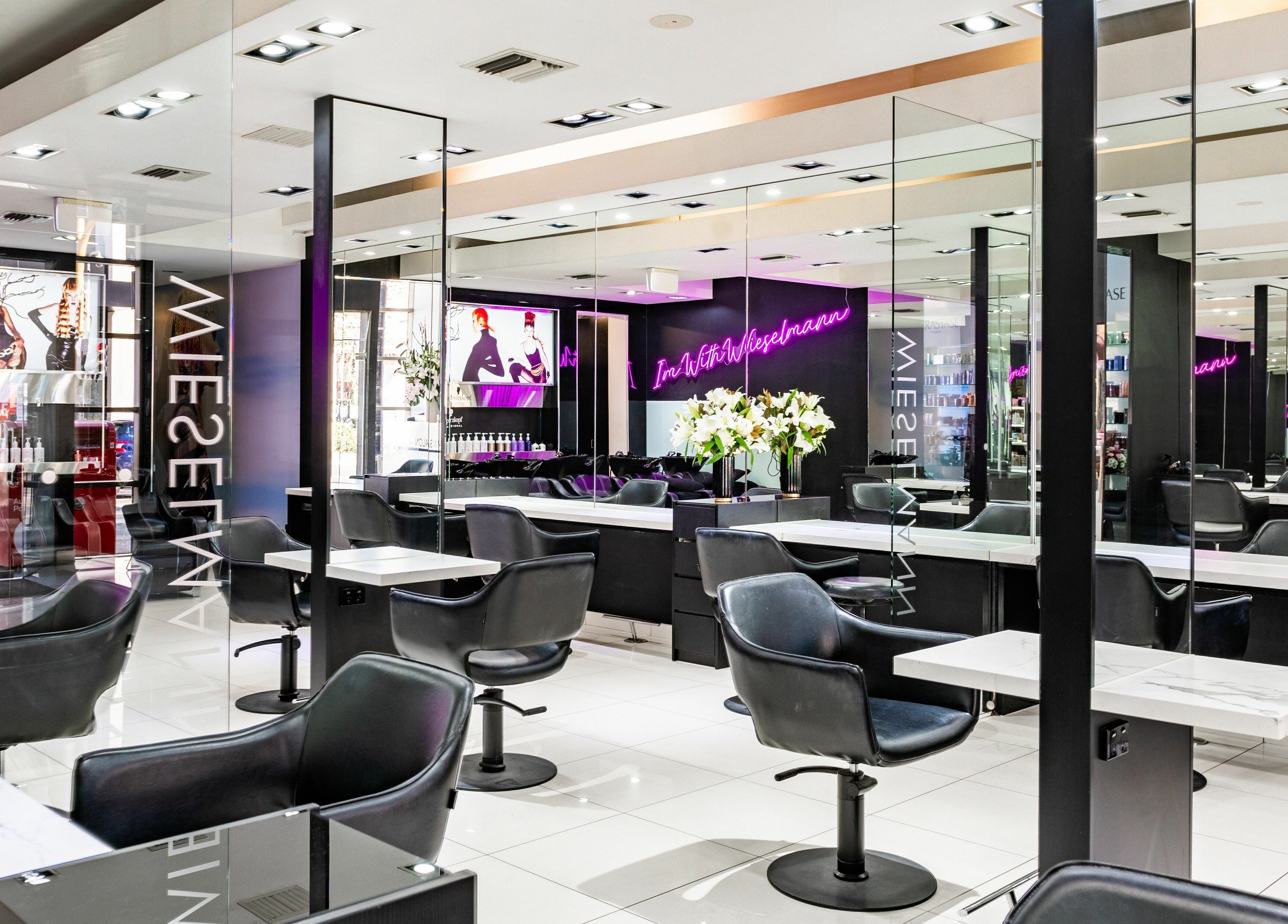 Interior of Wieselmann Salon, featuring sleek styling stations and modern decor in South Yarra, VIC, AU.