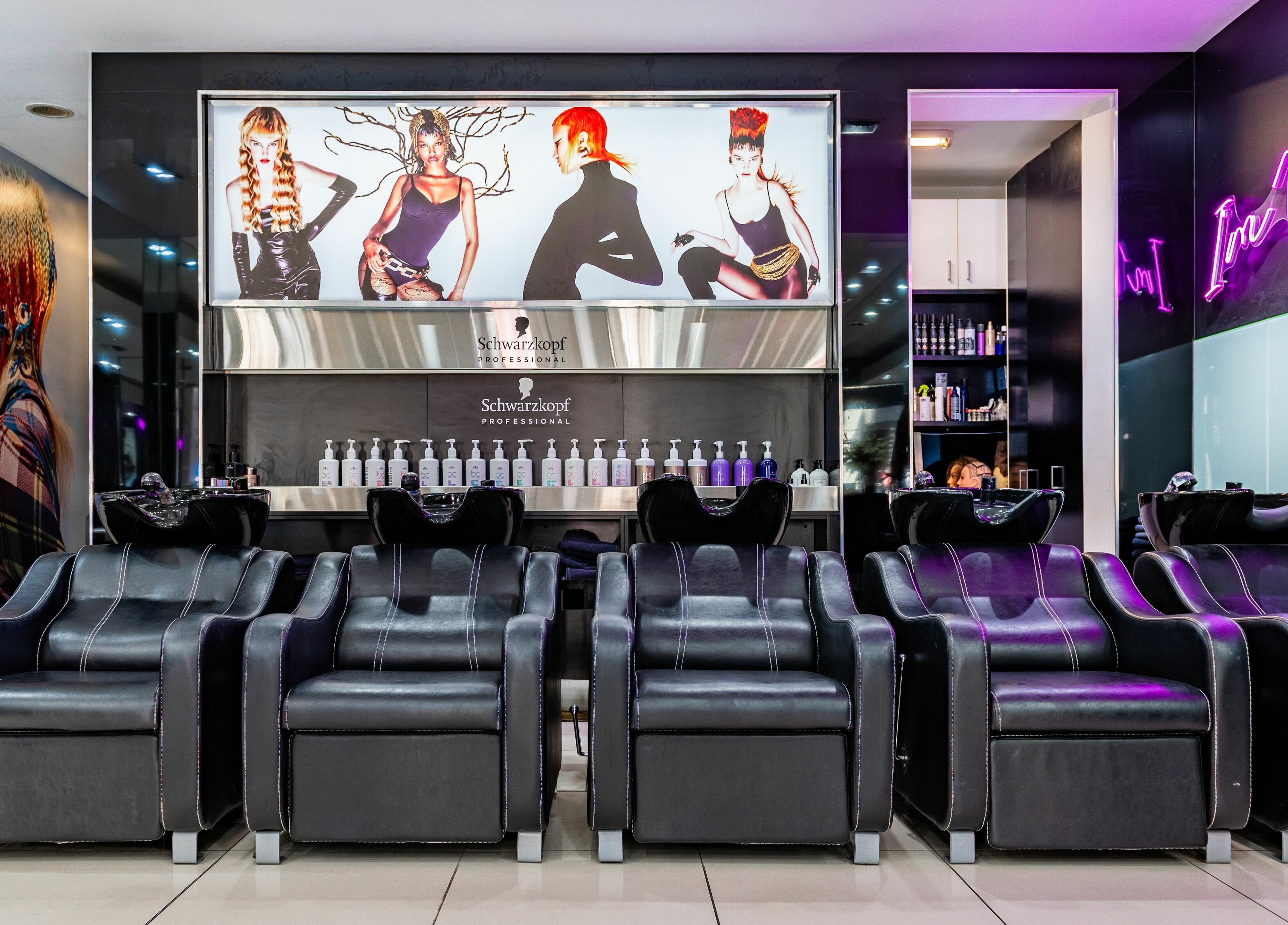 Luxurious wash stations at Wieselmann Salon, South Yarra, VIC, AU under vibrant lighting and chic decor.