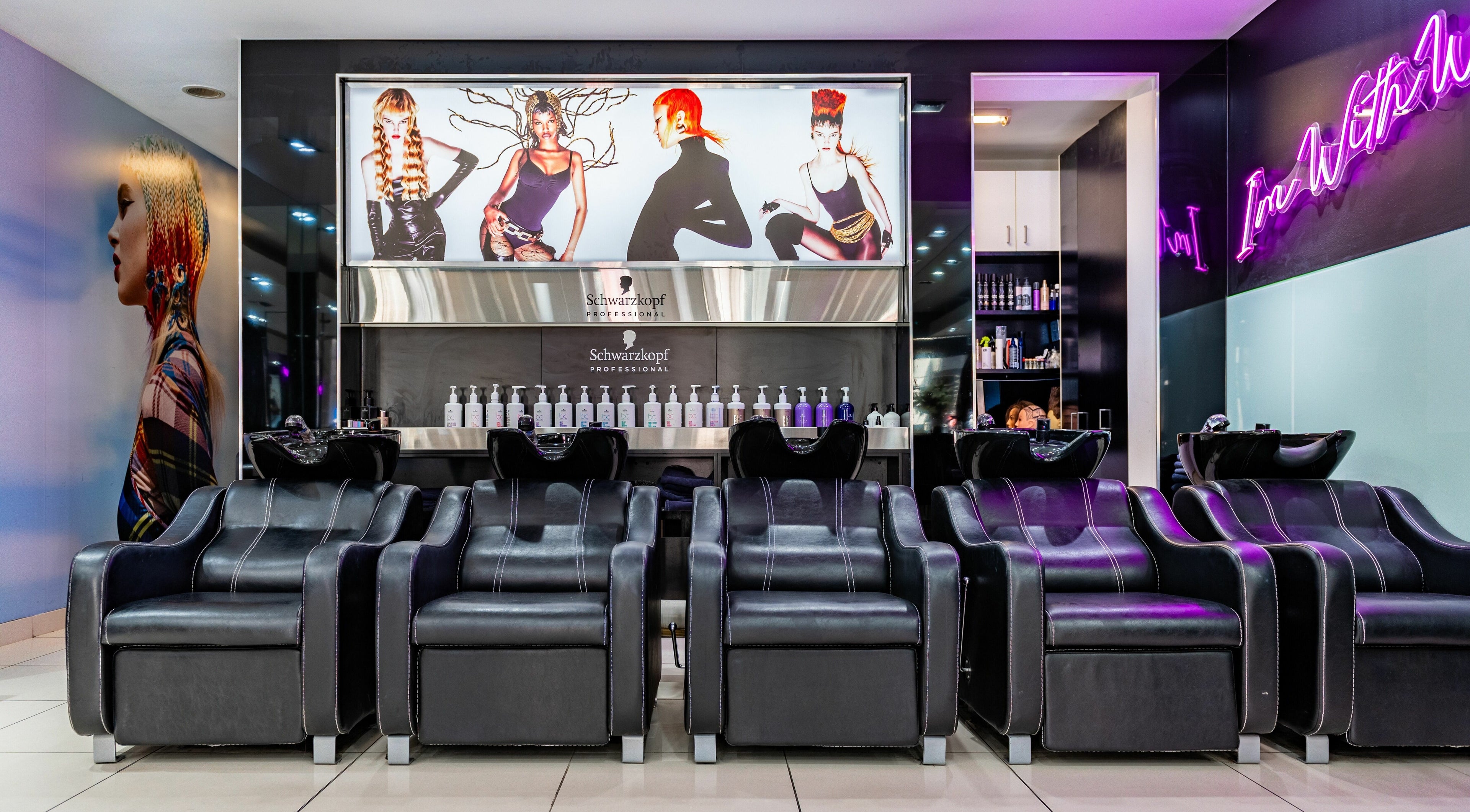 Luxurious wash stations at Wieselmann Salon, South Yarra, VIC, AU under vibrant lighting and chic decor.