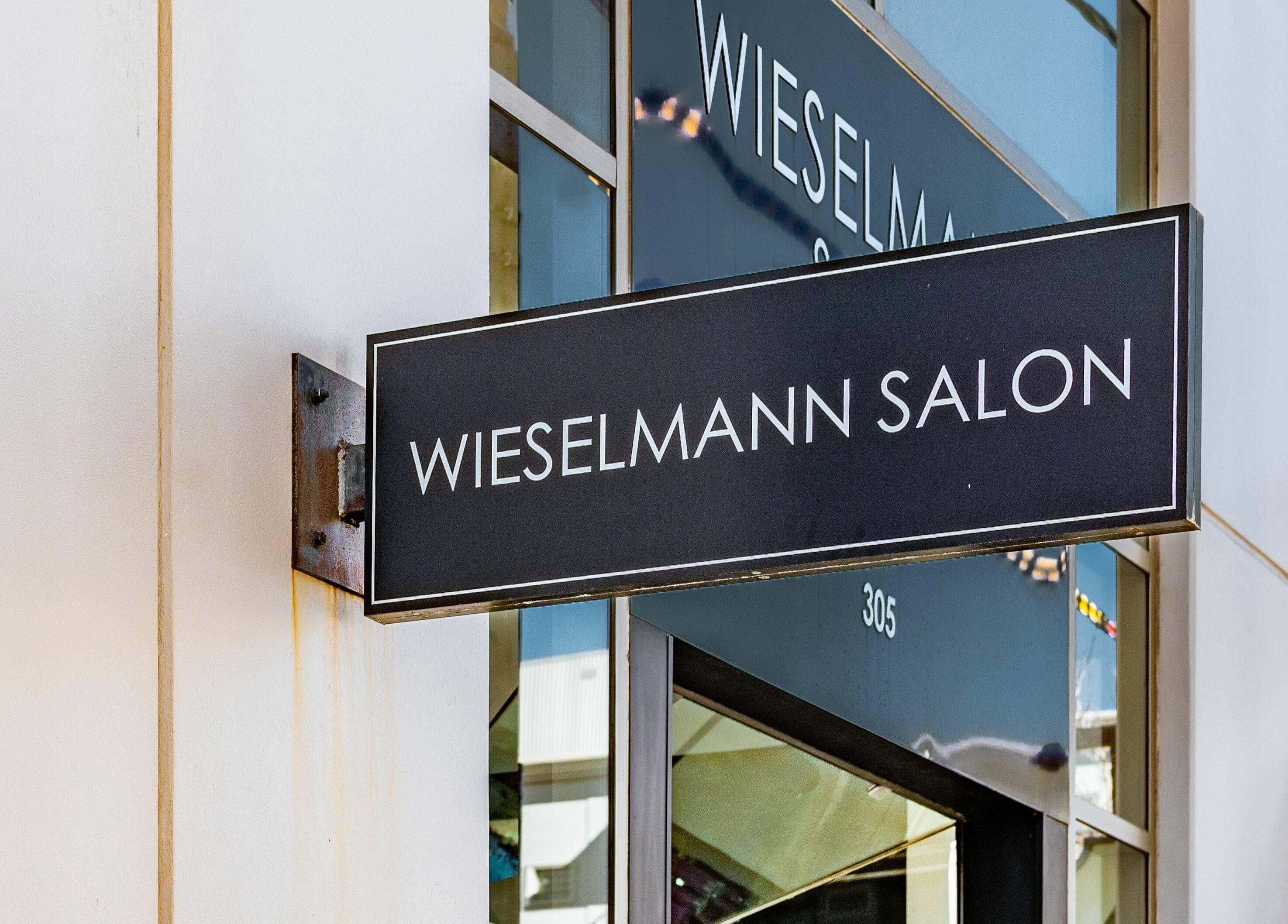 Entrance sign of Wieselmann Salon, South Yarra, VIC, AU, showcasing elegant modern design.