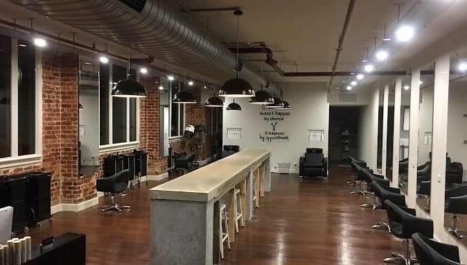 Chic interior of Sheldon Robson at head office hair suite, North Albury, New South Wales, AU with stylish mirrors and chairs.
