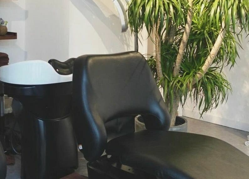 Relaxing salon space with plush chair at Fjino, Hong Kong Island, Hong Kong Island, HK.