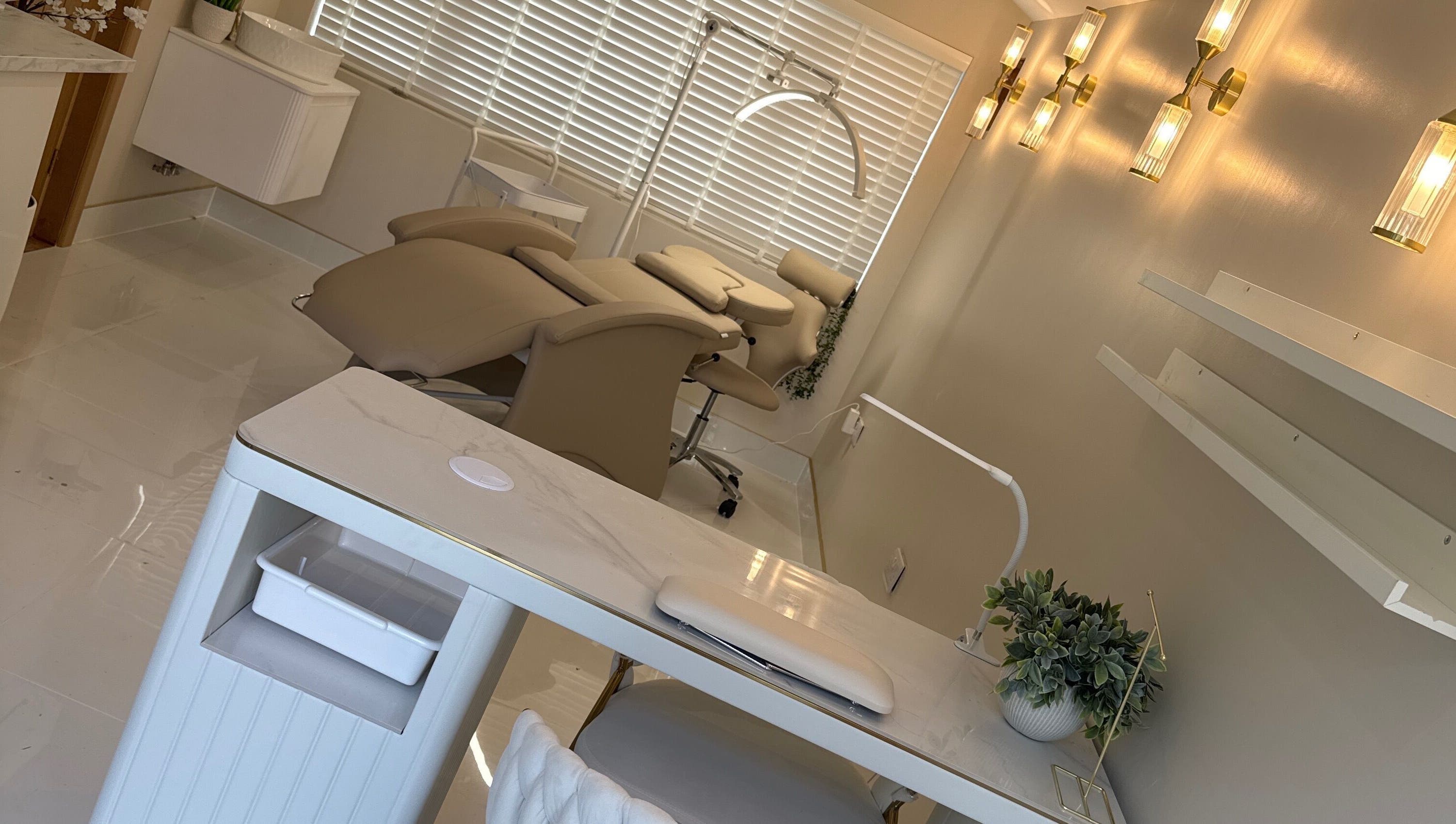 Serene treatment room at Sians Bty Studio, Waterlooville, England, GB with modern decor and plush seating.