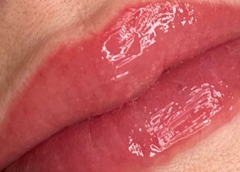 Close-up of glossy lips featuring lip treatment at Sians Bty Studio, Waterlooville, England, GB.