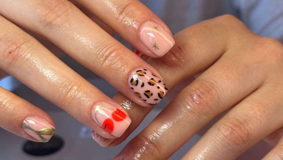 Creative nail art at The Beauty Shack, Fakenham, England, GB featuring leopard print and cherry designs.