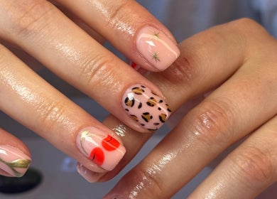 Creative nail art at The Beauty Shack, Fakenham, England, GB featuring leopard print and cherry designs.