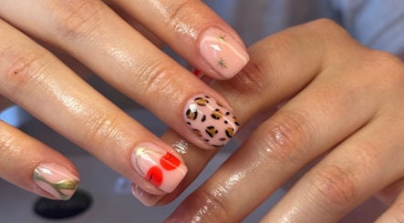 Creative nail art at The Beauty Shack, Fakenham, England, GB featuring leopard print and cherry designs.