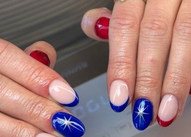 Close-up of vibrant starry nail art at The Beauty Shack, Fakenham, England, GB.
