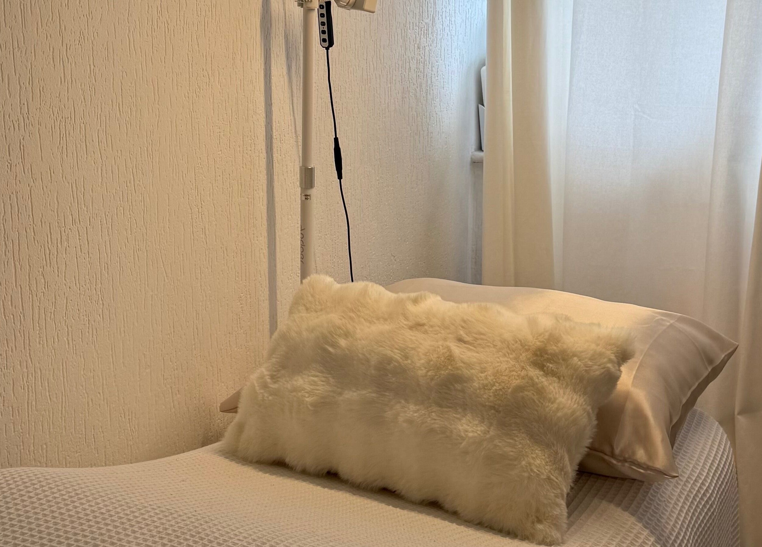 Luxurious massage bed with soft lighting at By KB, manchester, england, GB. Ideal for relaxation and rejuvenation.