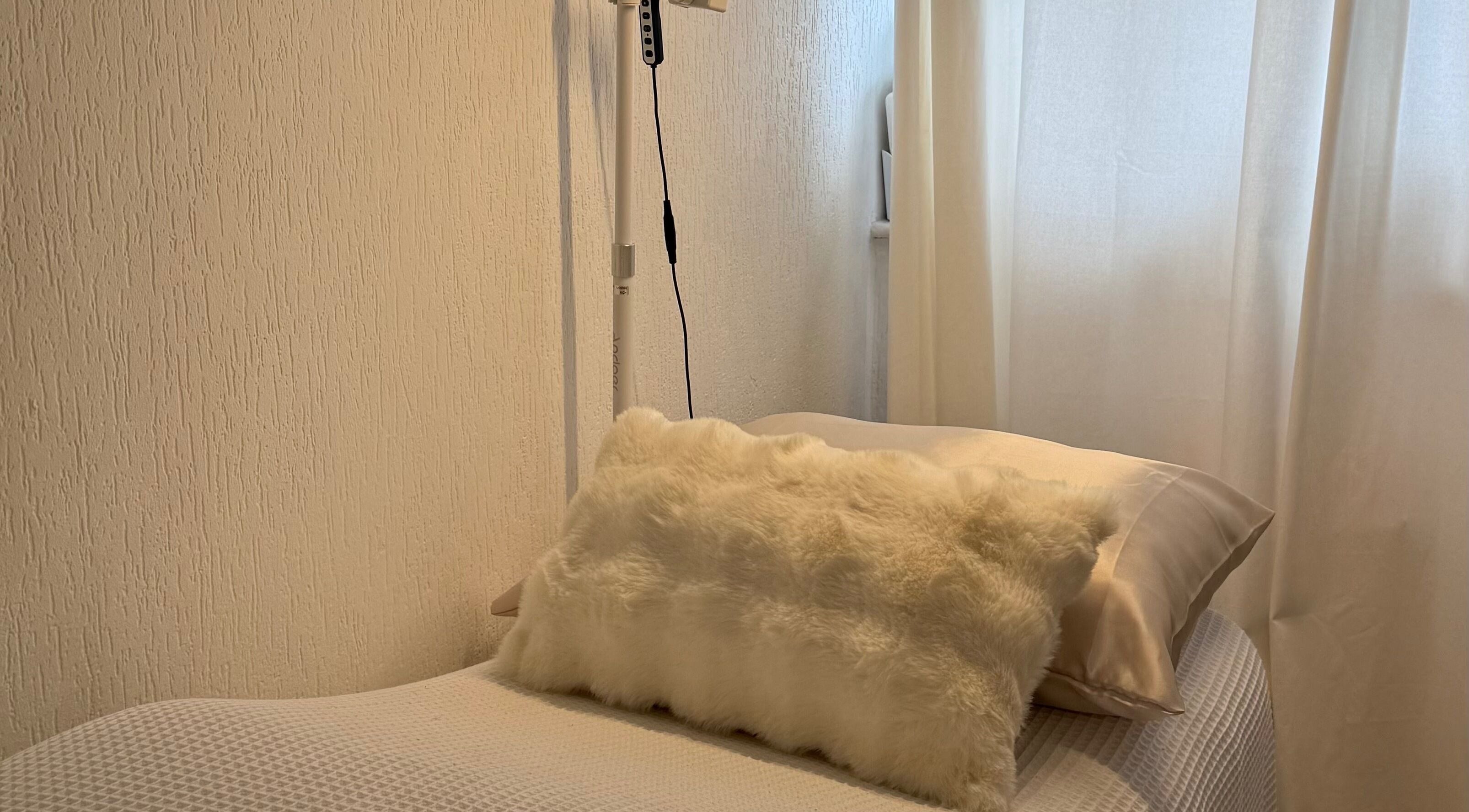 Luxurious massage bed with soft lighting at By KB, manchester, england, GB. Ideal for relaxation and rejuvenation.