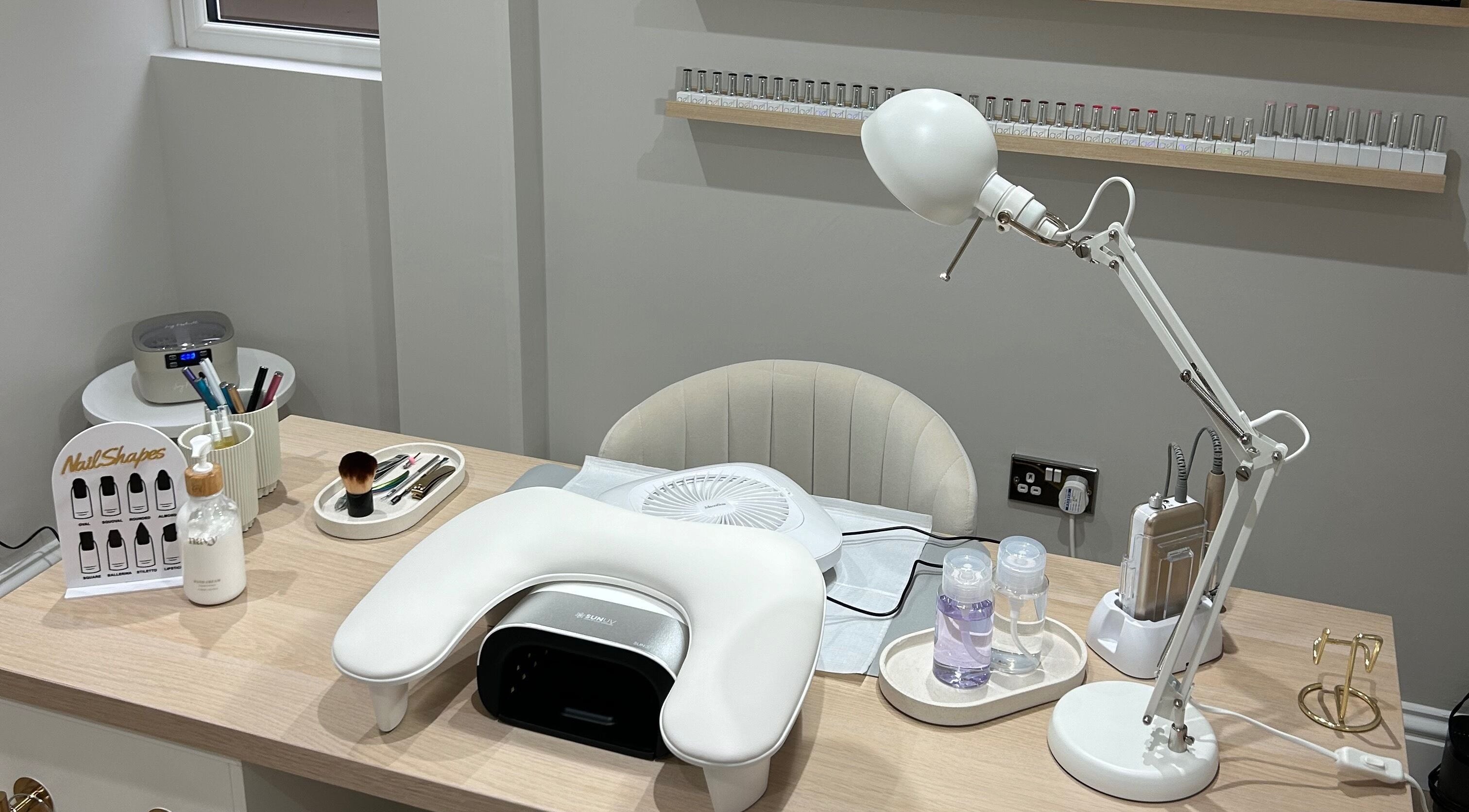 MD Nails setup in Bishop's Stortford, England, GB featuring a stylish manicure desk and tools.