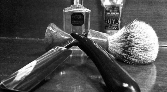 Vintage barber tools at The Barber Al Khuwair Branch, Muscat, OM, showcasing traditional shaving setup.