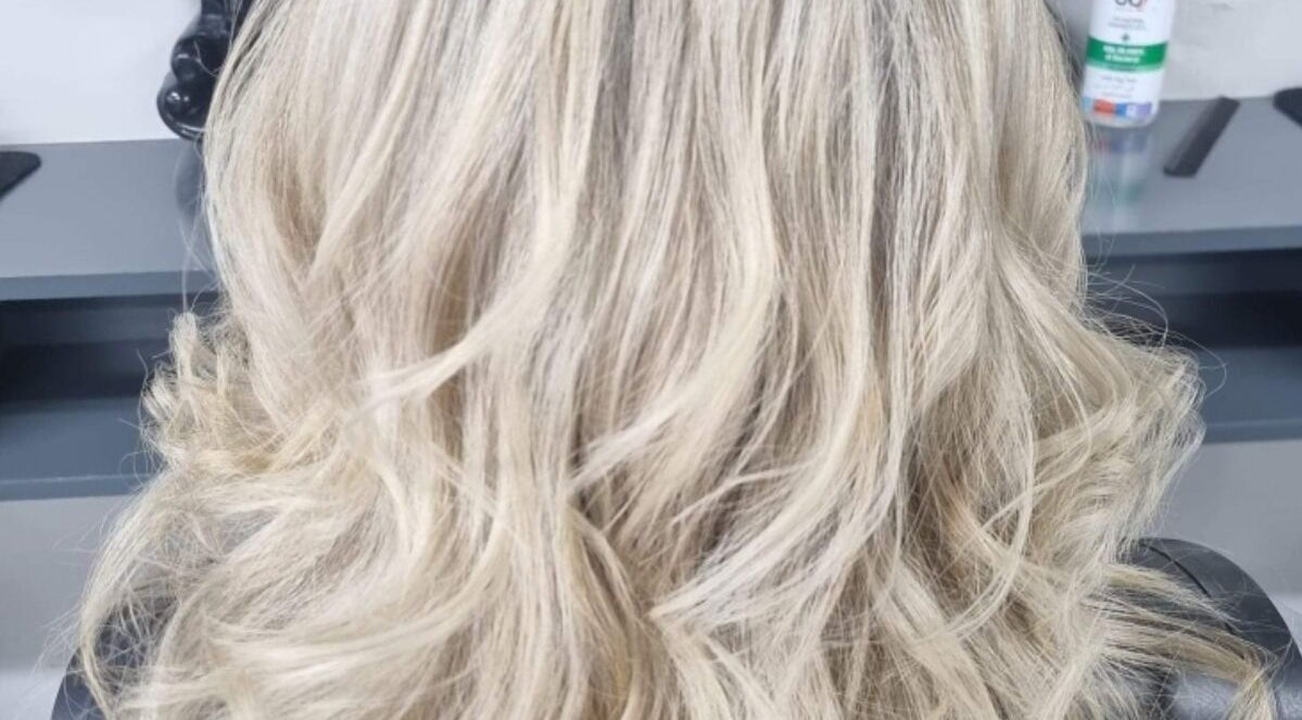 Blonde hair styled beautifully at CM Hairstylist, Newtownards, Northern Ireland, GB, showcasing expert curls.