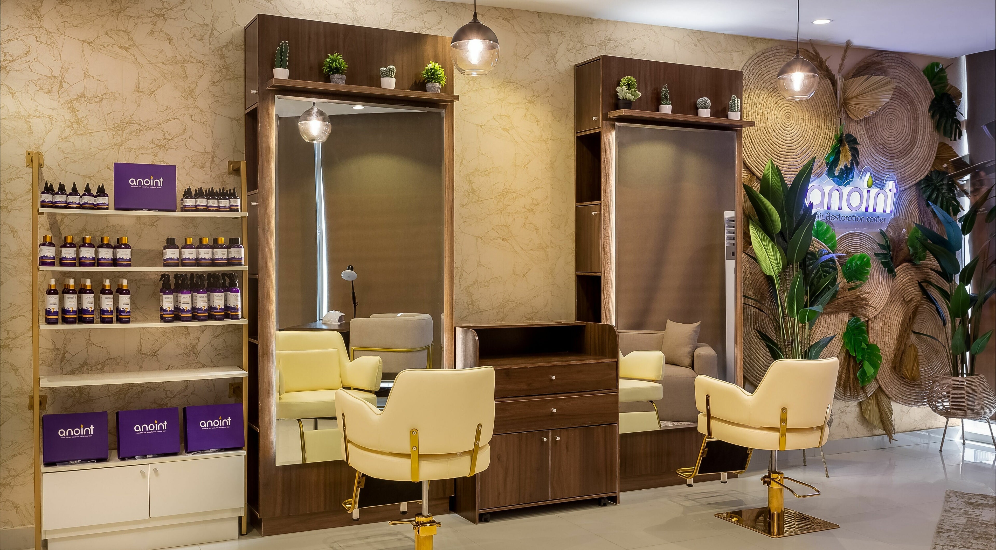 Chic interior of Anoint Hair Restoration Center VI, Lagos, Lagos, NG featuring modern styling stations and lush decor.