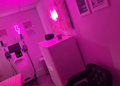 Chic pink room at Ep Laser Clinic Shrewsbury with neon lighting and modern equipment, Shrewsbury, England, GB.