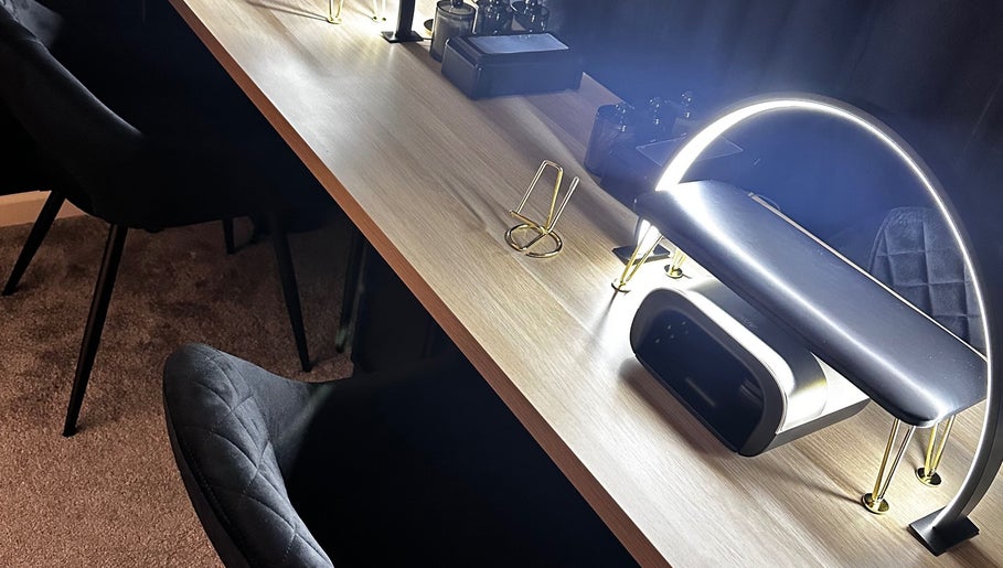 Elegant desk setup at Under The Lamp, Birmingham, England, GB with modern lighting.