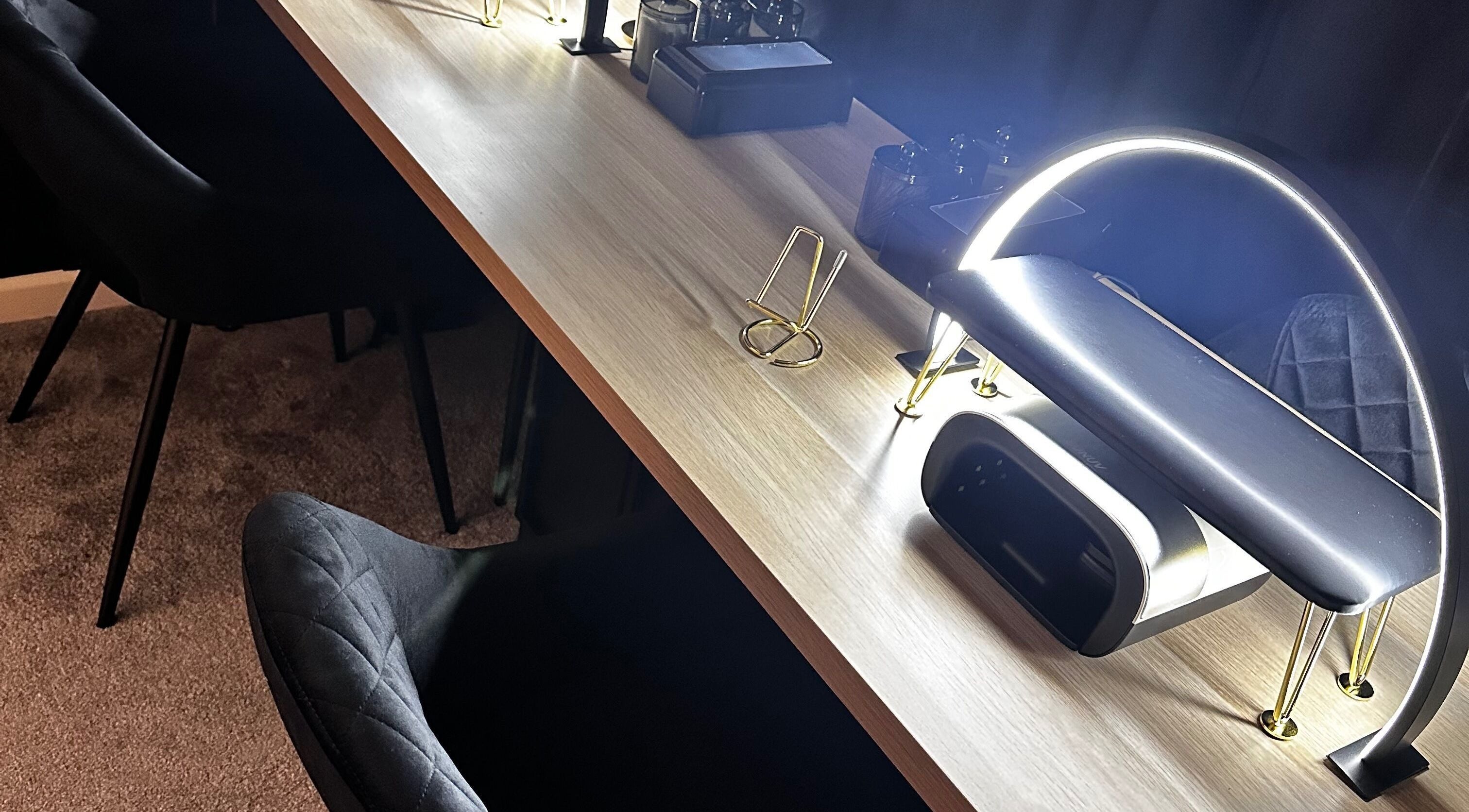 Elegant desk setup at Under The Lamp, Birmingham, England, GB with modern lighting.